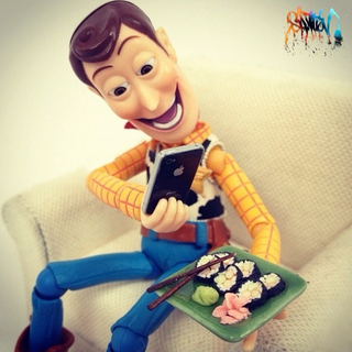 Illustration for article titled Toys Playing with Toy-Size Apple Gadgets Will Make You Either Sneer or Coo